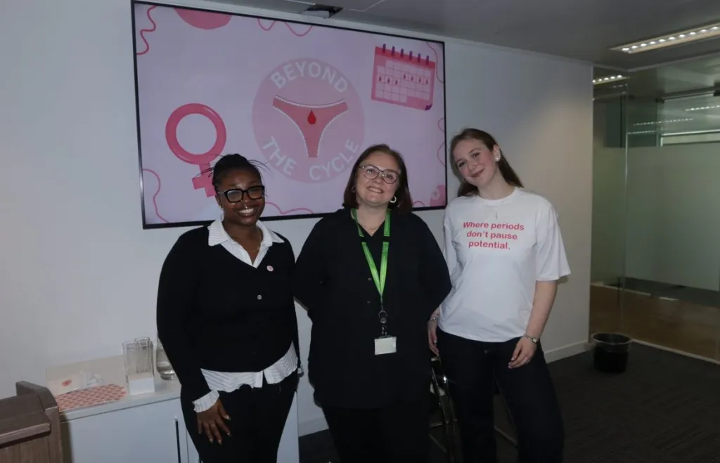 Three members of the Beyond the Cycle team at a workplace talk